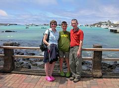 
Charlotte Ryan, Peter Ryan and Jerome Ryan at Puerto Ayora in front of Academy Bay, waiting for the pangas to go back to the Eden for lunch.
